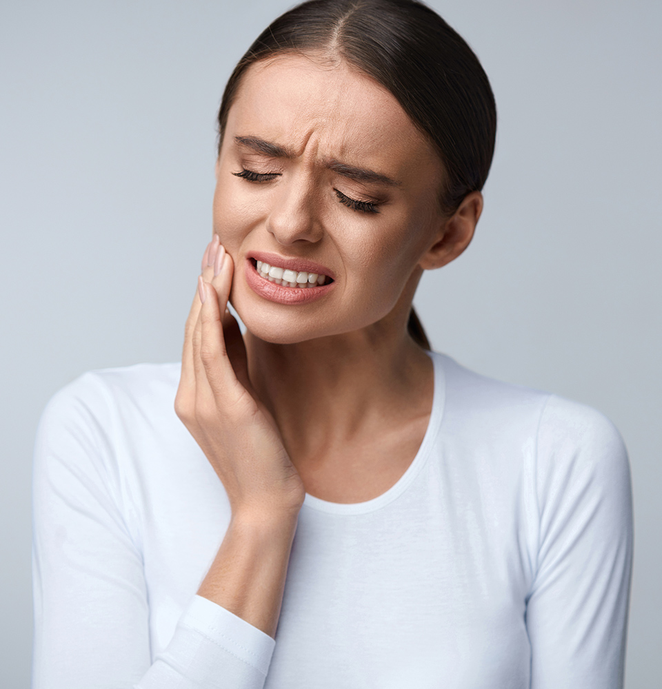 Patient experiencing discomfort from failing teeth