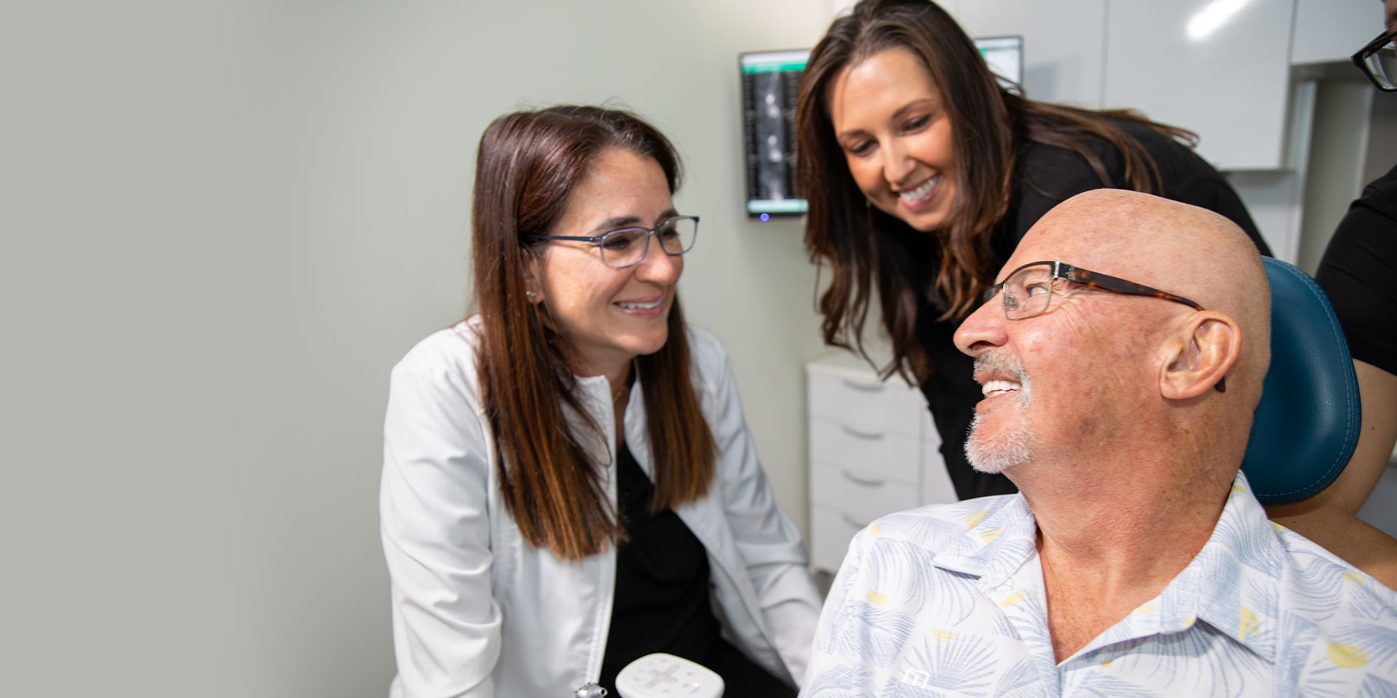Doctor answering a patient's questions about dental implants