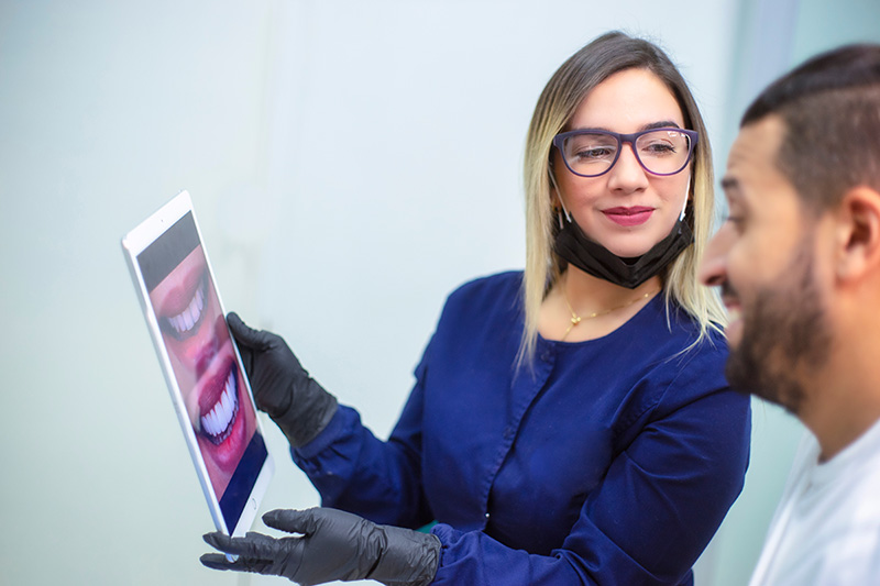 Dental staff showing a smile preview to a patient